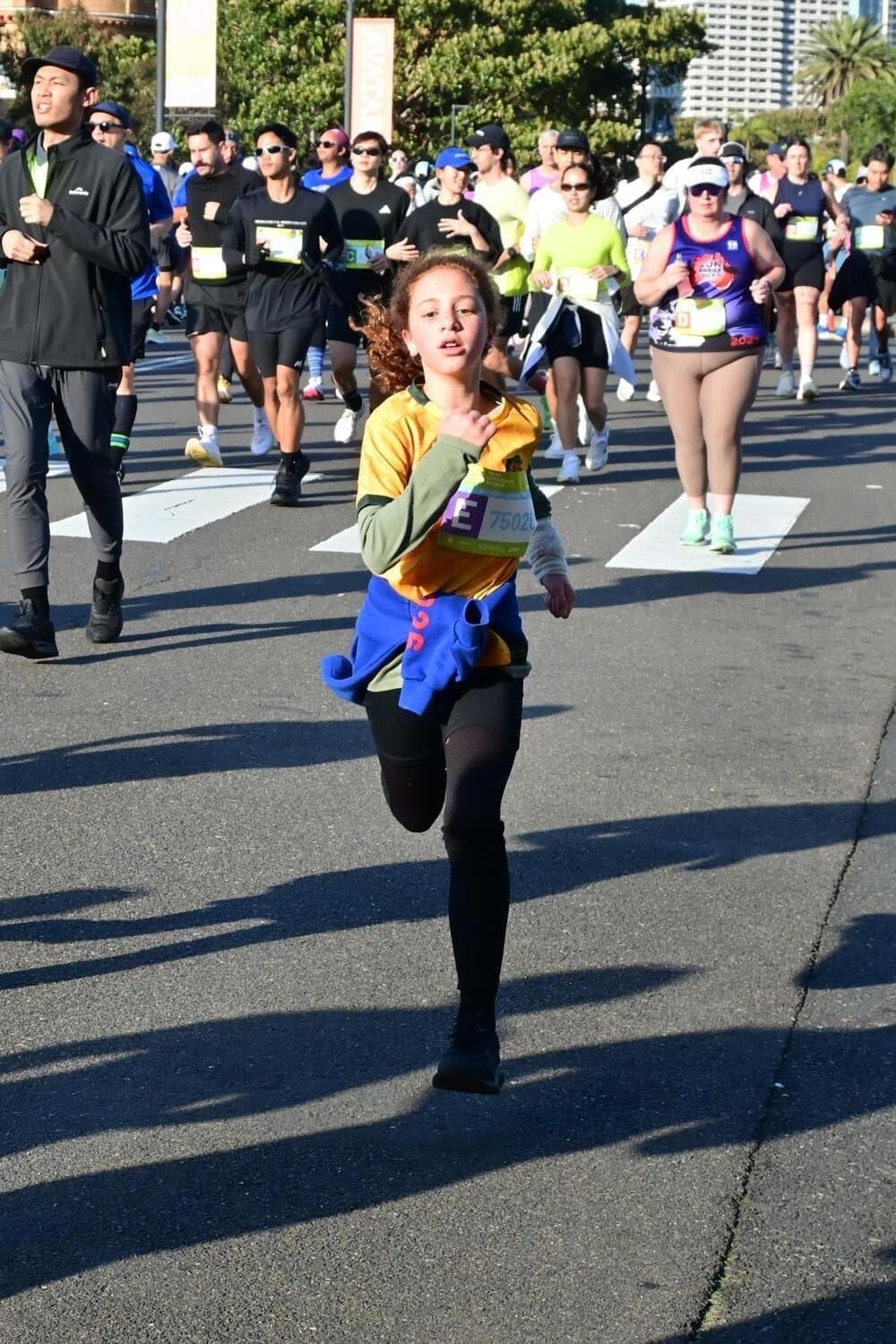 Young runner on the Sydney Marathon course